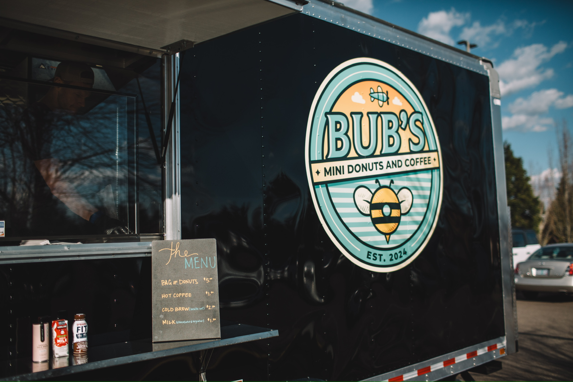 The illustrated Bub's logo on the side of the mini donut trailer